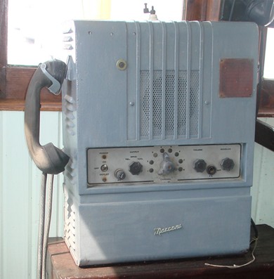 Tall desktop unit with speaker in the top section and a control panel below it - power supply space on the botton?